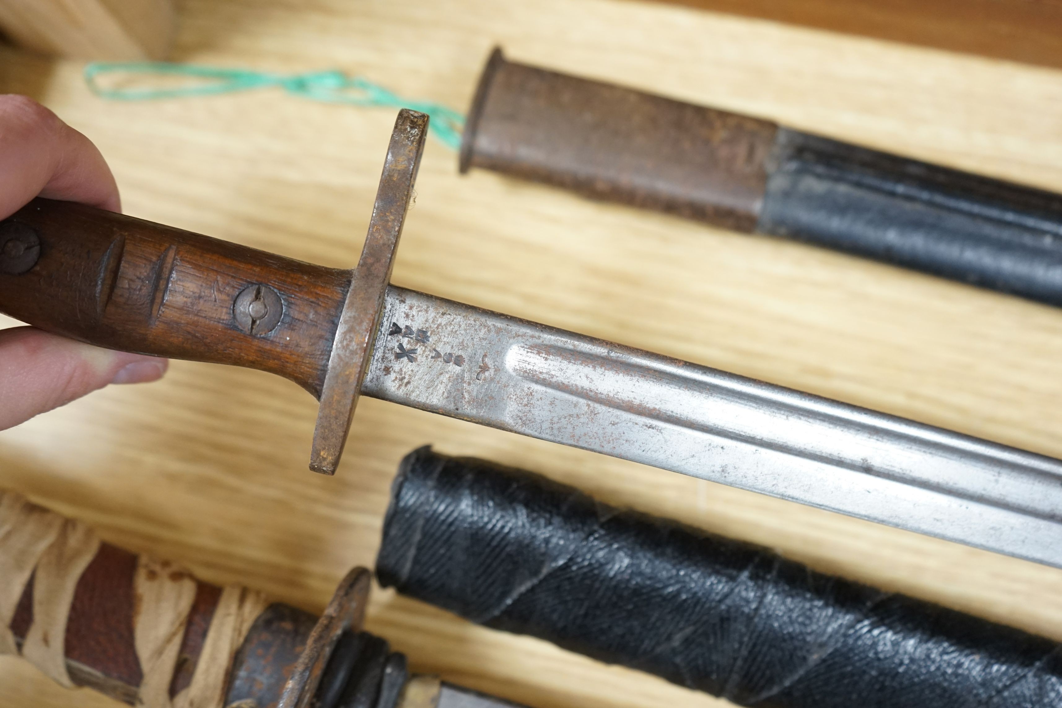 A Japanese wakizashi, a WWI bayonet and a Continental sword, sword 94cms long